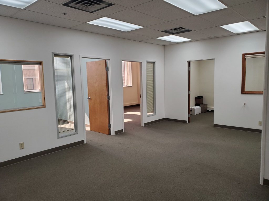Main area of office suite showing three offices, two on the left, and one forward